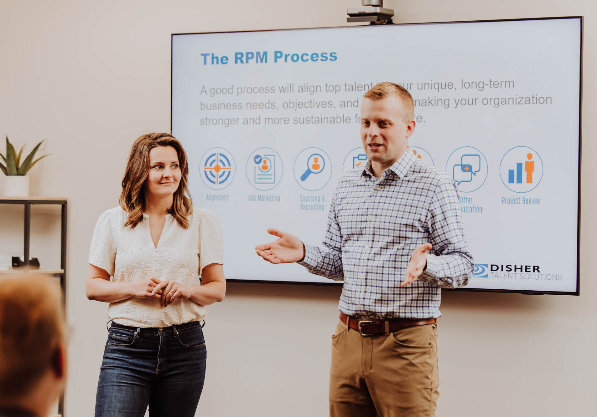 Two DISHER Talent recruiters present on the RPM process while in a workshop